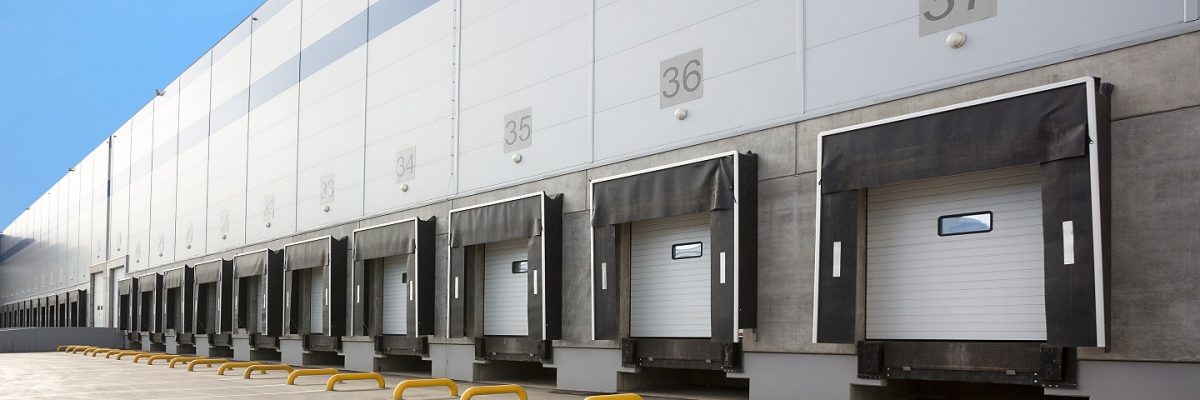 A,Large,Distribution,Warehouse,With,Gates,For,Loading,Goods A,Large,Distribution,Warehouse,With,Gates,For,Loading,Goods